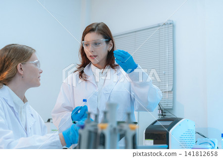Agricultural biotechnology experiment by female scientists for medicine discovery. Agricultural biotechnology experiment by female scientists for medicine discovery. 141812658