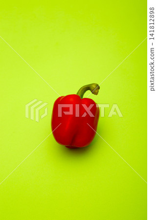 Red Sweet pepper on a green background Red Sweet pepper on a green background 141812898