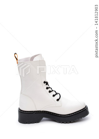 White women's thick-soled boot on a white background White women's thick-soled boot on a white background 141812903