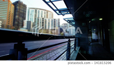 Highlighting metal railing and covered walkway running along city road, with glass canopy lights 141813206
