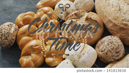 Showcasing braided rolls, boule and rustic loaf sitting on dark slate, with Christmas Time graphic Showcasing braided rolls, boule and rustic loaf sitting on dark slate, with Christmas Time graphic 141813638
