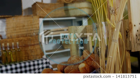 Displaying sesame rolls in market stall with baskets bottles checked cloth DATA PROTECTION overlay Displaying sesame rolls in market stall with baskets bottles checked cloth DATA PROTECTION overlay 141813751