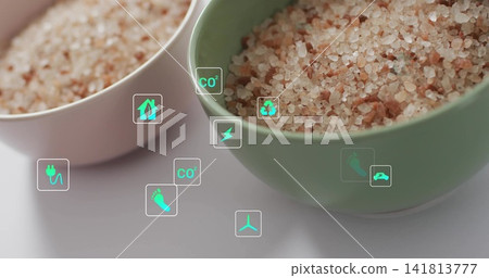 Displaying sage-green ceramic bowl with coarse pink salt on white tabletop, showing teal icons Displaying sage-green ceramic bowl with coarse pink salt on white tabletop, showing teal icons 141813777