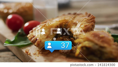 Displaying savory hand pie tearing open on rustic wooden table, with blue notification bubble Displaying savory hand pie tearing open on rustic wooden table, with blue notification bubble 141814300