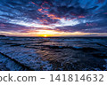 Scenic sundown on the sea shore with a breakwaters 141814632
