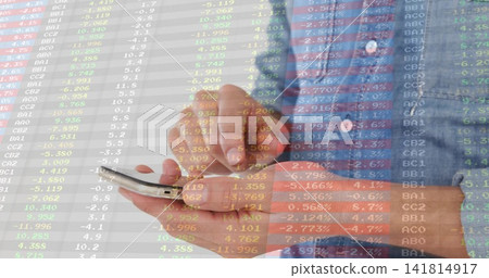 Tapping man in blue checkered shirt scrolling stock market tickers on smartphone in light interior Tapping man in blue checkered shirt scrolling stock market tickers on smartphone in light interior 141814917