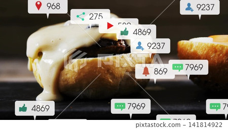 Showing cheeseburger with cheese dripping on dark slate, featuring bun edge and social callouts Showing cheeseburger with cheese dripping on dark slate, featuring bun edge and social callouts 141814922