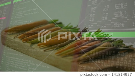 Showing colorful carrots lining wooden cutting board at desk setup, with code overlay Showing colorful carrots lining wooden cutting board at desk setup, with code overlay 141814957