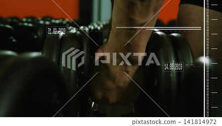Gripping man forearm flexing wrist veined at gym rubber dumbbell date scale overlay black shorts Gripping man forearm flexing wrist veined at gym rubber dumbbell date scale overlay black shorts 141814972