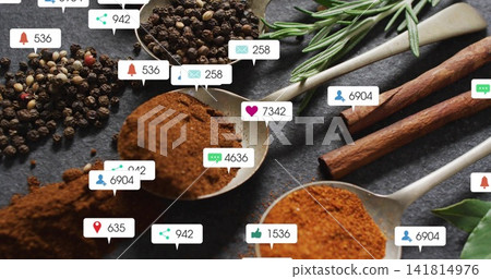 Displaying metal spoon holding brown spice sitting centered on dark slate, with icon bubbles 141814976
