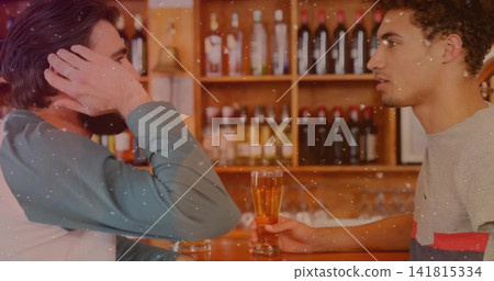 Talking two men leaning at wooden counter, holding amber pint, grey tee, green raglan, bottles Talking two men leaning at wooden counter, holding amber pint, grey tee, green raglan, bottles 141815334