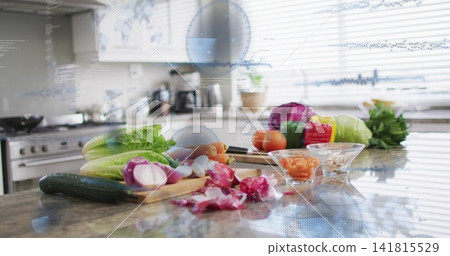 Displaying romaine, halved red onion, chef's knife on wood board at kitchen island with HUD overlay Displaying romaine, halved red onion, chef's knife on wood board at kitchen island with HUD overlay 141815529