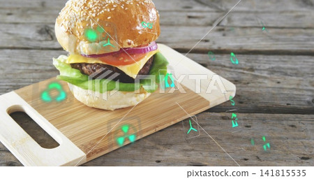 Displaying burger sitting on cutting board on weathered wood table, showing floating green AR icons 141815535