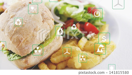 Showcasing white ceramic plate holding crusty roll sandwich with lettuce, fries, salad, green icons Showcasing white ceramic plate holding crusty roll sandwich with lettuce, fries, salad, green icons 141815580