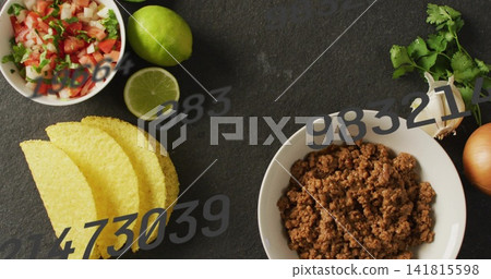 Showing white bowl with crumbled seasoned meat on dark slate with taco shells, pico, watermark Showing white bowl with crumbled seasoned meat on dark slate with taco shells, pico, watermark 141815598