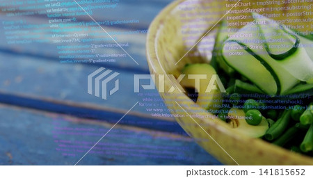 Displaying ceramic bowl holding cucumber ribbons and olives on blue table, code overlay, copy space Displaying ceramic bowl holding cucumber ribbons and olives on blue table, code overlay, copy space 141815652