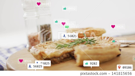 Showing hand pie sitting on wooden board on kitchen table, with rosemary, fork, shakers, overlays Showing hand pie sitting on wooden board on kitchen table, with rosemary, fork, shakers, overlays 141815656