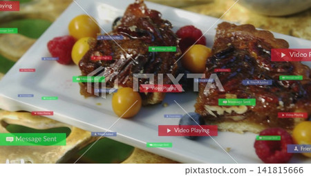 Showing two nut-filled pastry slices resting on white plate on gold tray with raspberries, overlays 141815666