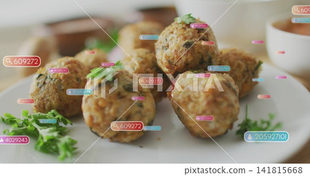 Showing centered golden fritters on white plate in kitchen, with parsley, dipping-bowls and UI tags Showing centered golden fritters on white plate in kitchen, with parsley, dipping-bowls and UI tags 141815668