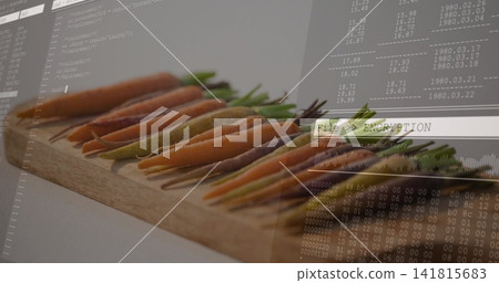 Displaying row of baby carrots with green tops on wooden board, showing File ENCRYPTION overlay Displaying row of baby carrots with green tops on wooden board, showing File ENCRYPTION overlay 141815683