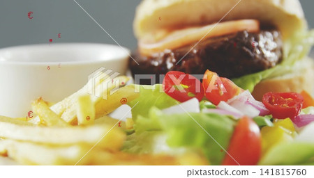 Featuring plated burger meal resting on plate at restaurant table, with fries and salad Featuring plated burger meal resting on plate at restaurant table, with fries and salad 141815760