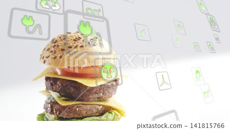 Displaying double burger with seeded bun, beef patties on studio set with eco icons, copy space Displaying double burger with seeded bun, beef patties on studio set with eco icons, copy space 141815766