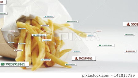 Displaying paper cone of seasoned fries on white tabletop with scattered digital labels, copy space 141815789