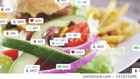 Showing salad with avocado, tomato, onion, olives on plate, featuring blurred burger, fries, badges Showing salad with avocado, tomato, onion, olives on plate, featuring blurred burger, fries, badges 141815886