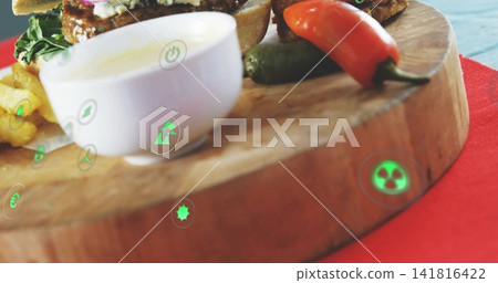 Showing wooden serving board with sauce bowl, sandwich, peppers on red runner and holographic icons Showing wooden serving board with sauce bowl, sandwich, peppers on red runner and holographic icons 141816422