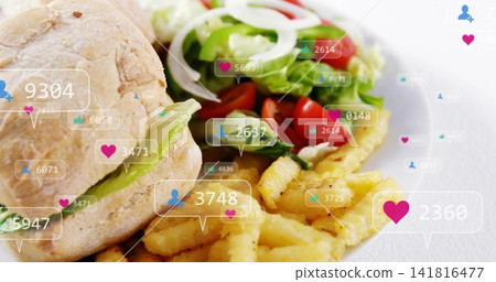 Presenting plated meal on white plate on tabletop, roll with green filling, fries, salad, overlays Presenting plated meal on white plate on tabletop, roll with green filling, fries, salad, overlays 141816477