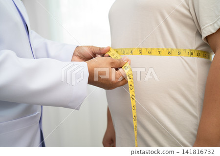Asian woman with fat belly big size overweight and obesity with measure tape. Asian woman with fat belly big size overweight and obesity with measure tape. 141816732