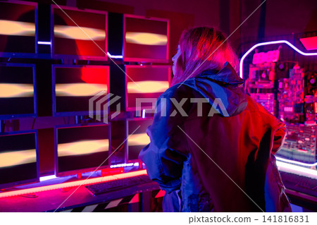 Woman hacker failing. Angry Asian woman wearing a black jacket hacking programming system access denied on computer monitor display Woman hacker failing. Angry Asian woman wearing a black jacket hacking programming system access denied on computer monitor display 141816831