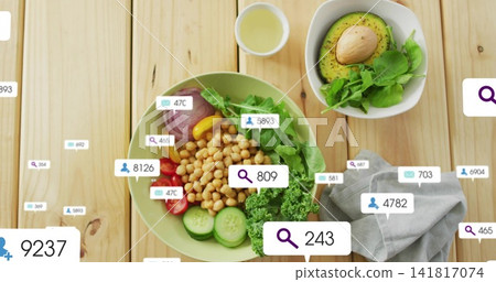 Displaying green ceramic salad bowl on light wooden tabletop, with chickpeas and overlay badges Displaying green ceramic salad bowl on light wooden tabletop, with chickpeas and overlay badges 141817074