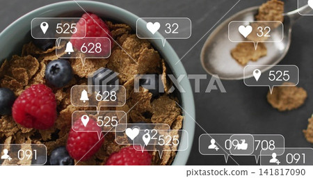 Displaying light-blue bowl of bran cereal with raspberries, blueberries on slate, spoon, UI alerts Displaying light-blue bowl of bran cereal with raspberries, blueberries on slate, spoon, UI alerts 141817090