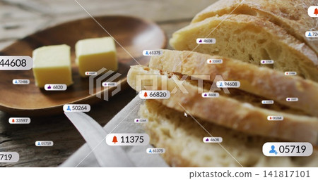 Showing rustic sliced loaf on wood table in kitchen, with butter pats, plate, linen, labels, cursor Showing rustic sliced loaf on wood table in kitchen, with butter pats, plate, linen, labels, cursor 141817101