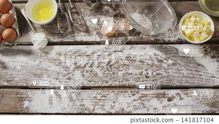 Showing floured wooden tabletop on kitchen counter, with eggs, beaters, cutters and overlay Showing floured wooden tabletop on kitchen counter, with eggs, beaters, cutters and overlay 141817104