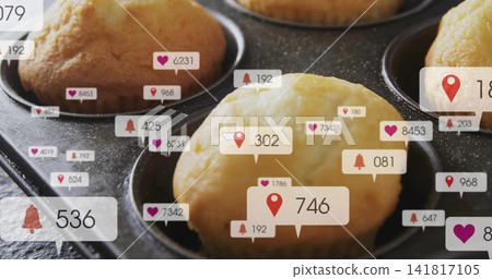 Showing single domed muffin sitting in metal muffin tin in kitchen, with floating alert badges Showing single domed muffin sitting in metal muffin tin in kitchen, with floating alert badges 141817105