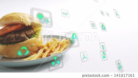 Showing brioche burger with lettuce tomato beef on pale-blue plate studio green icons, copy space Showing brioche burger with lettuce tomato beef on pale-blue plate studio green icons, copy space 141817161