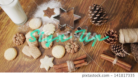 Displaying cookies, nested star cutters, cinnamon bundles, milk, teal Sign Up on wooden tabletop Displaying cookies, nested star cutters, cinnamon bundles, milk, teal Sign Up on wooden tabletop 141817335