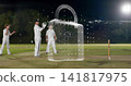 Hovering 3D padlock hologram overlaying night cricket pitch, covering stumps and players in whites 141817975