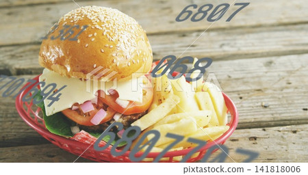 Showing cheeseburger with fries, sesame bun in red basket sitting on wood table, numeric overlays Showing cheeseburger with fries, sesame bun in red basket sitting on wood table, numeric overlays 141818006