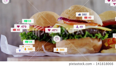 Displaying three mini burger sliders on wooden board at food studio, with social media icons Displaying three mini burger sliders on wooden board at food studio, with social media icons 141818008
