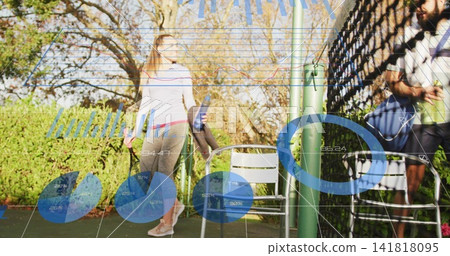 Standing fit woman in athletic wear holding reusable bottle and towel near court fence, copy space 141818095