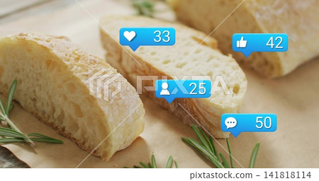 Displaying sliced rustic bread on brown paper on table, with rosemary and four blue social bubbles Displaying sliced rustic bread on brown paper on table, with rosemary and four blue social bubbles 141818114
