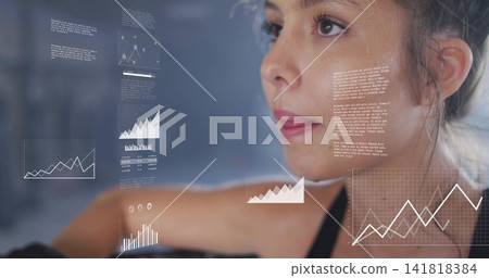 Studying woman wearing black sports tank analyzing AR charts over workout bench at gym, copy space Studying woman wearing black sports tank analyzing AR charts over workout bench at gym, copy space 141818384
