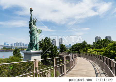 View of the French Statue of Liberty replica at Odaiba Seaside Park, Minato City, Tokyo, Japan, with the Rainbow Bridge in the background. View of the French Statue of Liberty replica at Odaiba Seaside Park, Minato City, Tokyo, Japan, with the Rainbow Bridge in the background. 141818462
