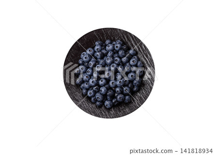 Fresh, ripe, and juicy wild blueberries as an ingredient for vegetarian dishes Fresh, ripe, and juicy wild blueberries as an ingredient for vegetarian dishes 141818934