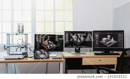 Modern engineering workspace with a 3d printer and multiple monitors 3d modeling software on a desk in a bright office Modern engineering workspace with a 3d printer and multiple monitors 3d modeling software on a desk in a bright office 141819151