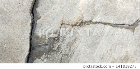 Deep cracks and water stains on the concrete surface texture. Deep cracks and water stains on the concrete surface texture. 141819275