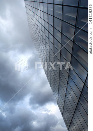 Modern architecture and stormy sky on background Modern architecture and stormy sky on background 141819286